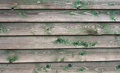 Image showing Texture of wall made of planks with paint peeling off close-up