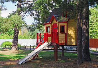 Image showing Bright children's wooden house with slide