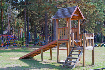 Image showing Wooden slide on playground