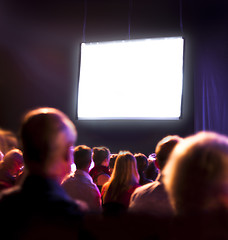 Image showing Crowd audience looking at screen