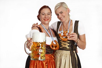 Image showing Two bavarian girls with beer in traditional costumes