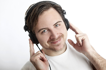 Image showing Attractive man with headphones in front of a white background lo