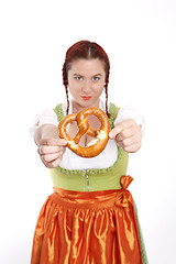 Image showing Young red head woman in traditional bavarian costume