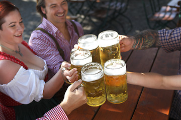 Image showing People drinking beer in a traditional Bavarian beer garden