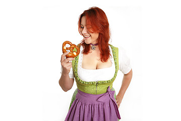 Image showing Young red head woman in traditional bavarian costume