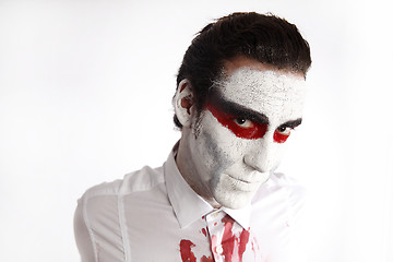 Image showing Man with white mascara and bloody shirt