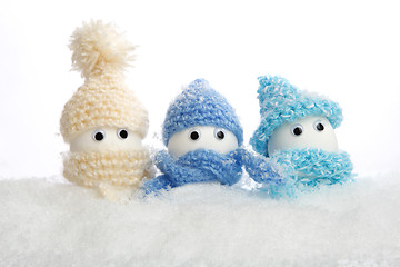 Image showing Eggs with hats in the snow