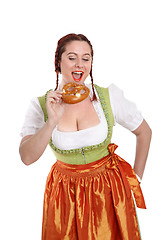 Image showing Young red head woman in traditional bavarian costume