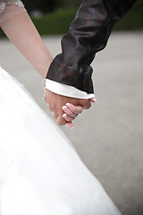 Image showing Hands of a bride and groom