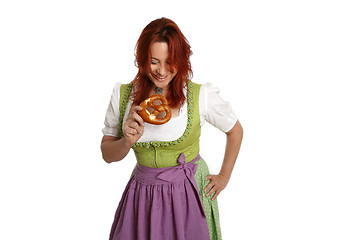 Image showing Young red head woman in traditional bavarian costume