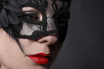 Image showing Red head woman wearing mask