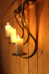 Image showing Burning candles as wall decoration