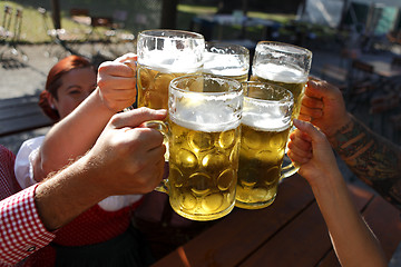 Image showing People drinking beer in a traditional Bavarian beer garden