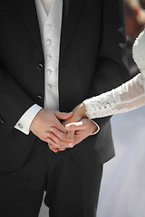 Image showing Hands of a bride and groom