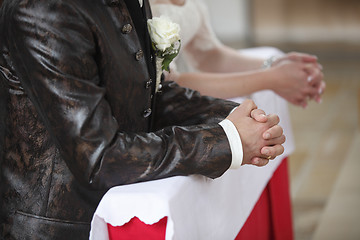 Image showing Hands of a bride and groom