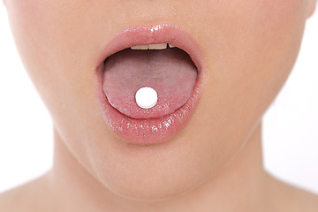 Image showing Woman takes pill