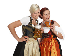 Image showing Two bavarian girls with beer in traditional costumes