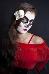 Image showing Woman with makeup of la Santa Muerte with white roses