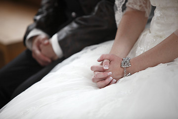 Image showing Hands of a bride and groom