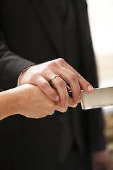 Image showing Hands of a bride and groom