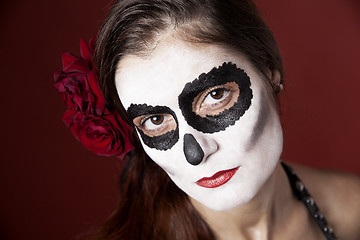 Image showing Woman with makeup of la Santa Muerte with red roses