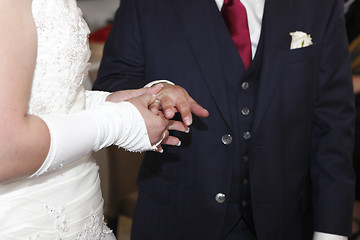 Image showing Hands of a bride and groom