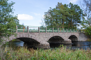 Image showing Old bridge over a small river