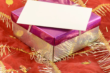 Image showing A red gift with a white ribbon and a bow