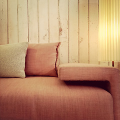 Image showing Old fashioned pink sofa and lamp