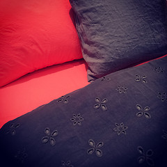 Image showing Red and black bed linen