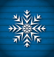 Image showing Geometric snowflake on wooden background