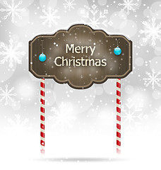 Image showing Snow covered wooden sign, Merry Christmas background 