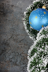 Image showing Christmas decorations - ball and spruce tinsel