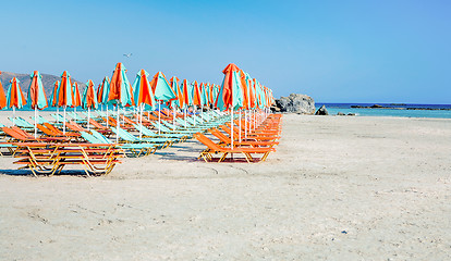 Image showing Sunloungers on a beach