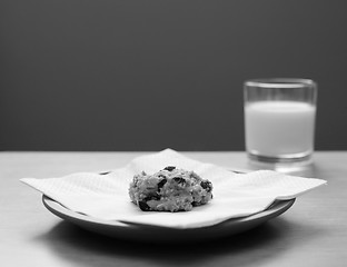 Image showing Oatmeal raisin cookie with a glass of milk 