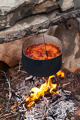 Image showing Borscht (Ukrainian soup) cooking on campfire