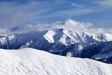 Image showing Off-piste slope and sky with clouds at evening