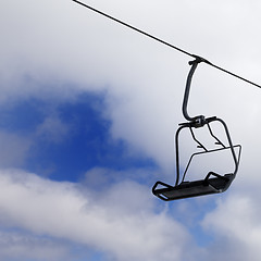 Image showing Chair-lift and cloudy sky