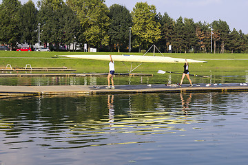 Image showing Rowers wear boat