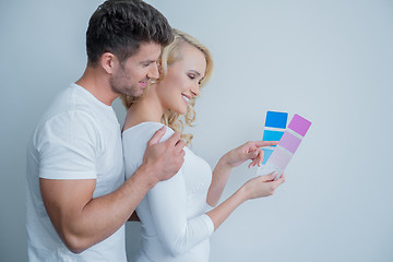 Image showing Happy Couple Looking at Color Indicator Paper