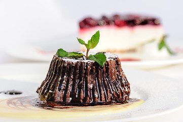 Image showing Chocolate fondant with peppermint leaves