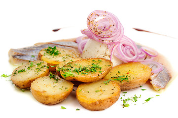 Image showing Roast potatoes with hering and onion