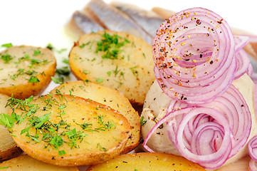 Image showing Roast potatoes with hering and onion