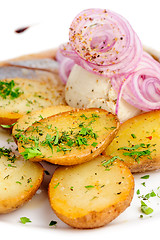 Image showing Roast potatoes with hering and onion