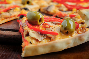 Image showing Pizza with Mozzarella, Mushrooms, Olives and Tomato Sauce