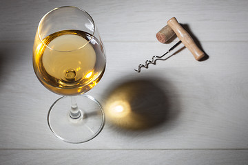 Image showing Glass of white wine on wooden table