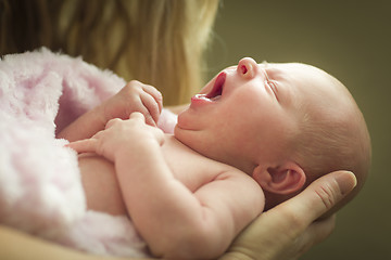 Image showing Hands of Mother Holding Her Newborn Baby Girl