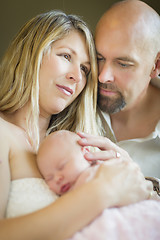 Image showing Beautiful Young Couple Holding Their Newborn Baby Girl