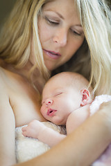 Image showing Young Beautiful Mother Holding Her Precious Newborn Baby Girl