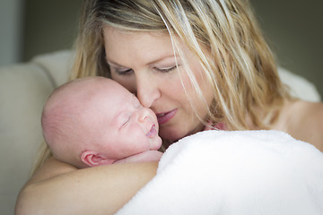 Image showing Young Beautiful Mother Holding Her Precious Newborn Baby Girl